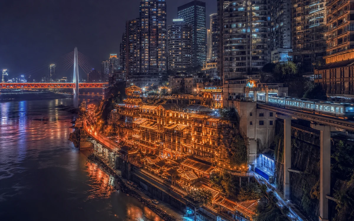 Layered Chongqing at night with Hongya Cave, monorail and river lights