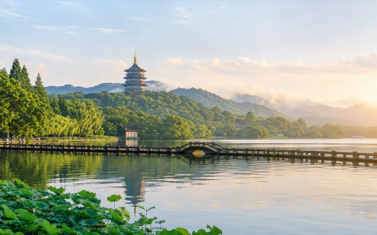 West Lake, Leifeng Pagoda and lotus leaves in warm morning light